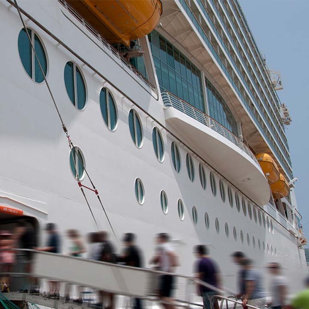 Passengers loading onto a cruise ship