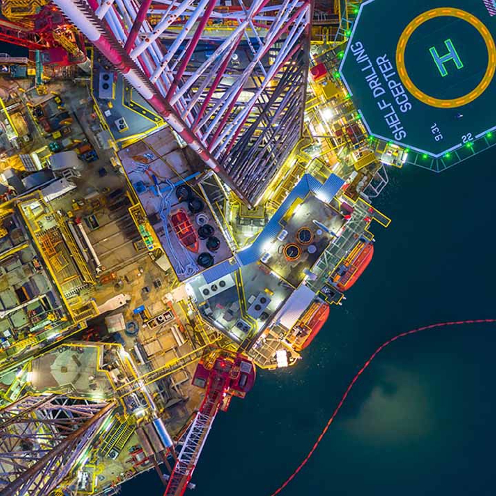 Offshore platform from above at night lit up