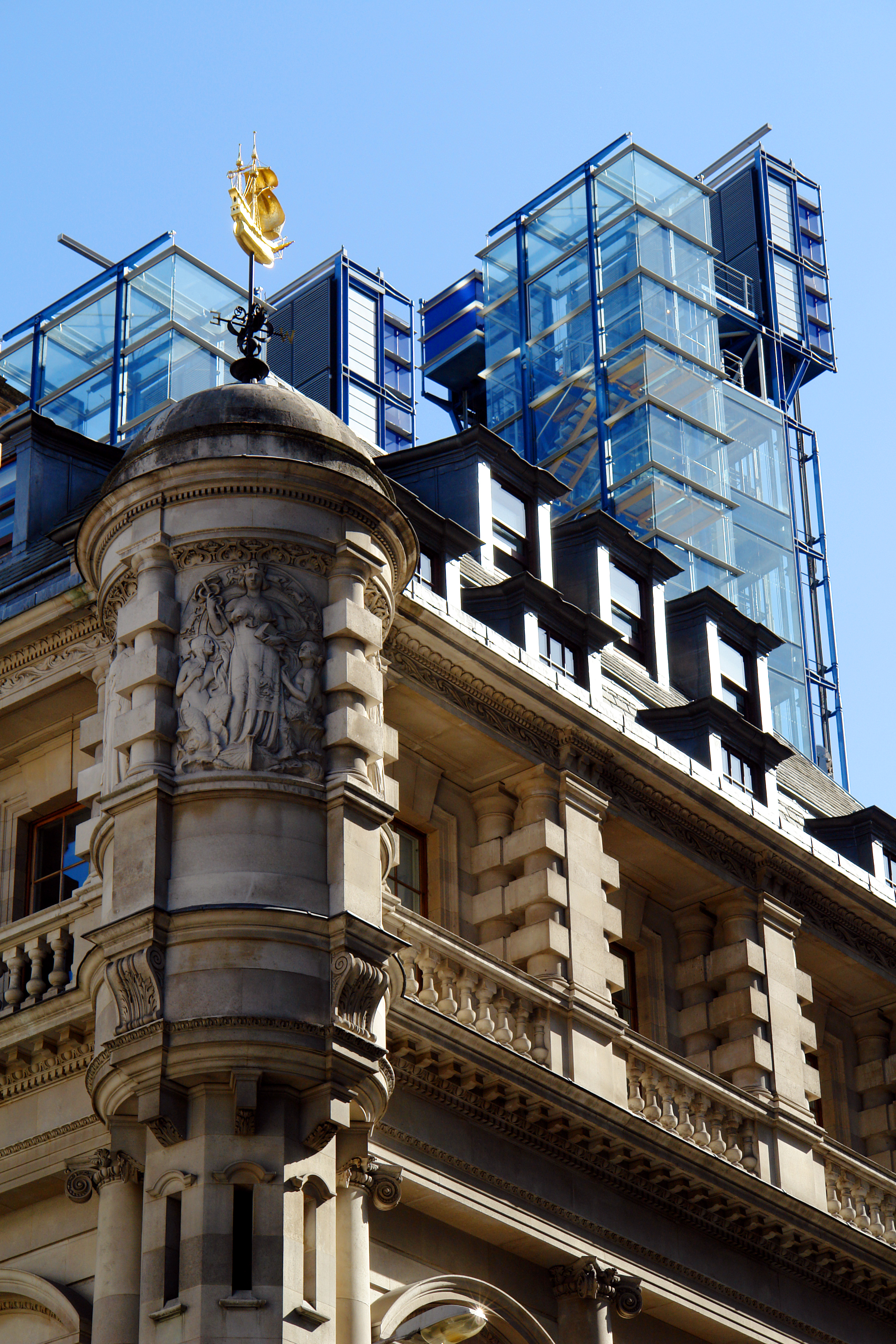 The Colcutt building (1901) stands in front of the Richard Rogers building (2000), comprising our London offices in Fenchurch Street