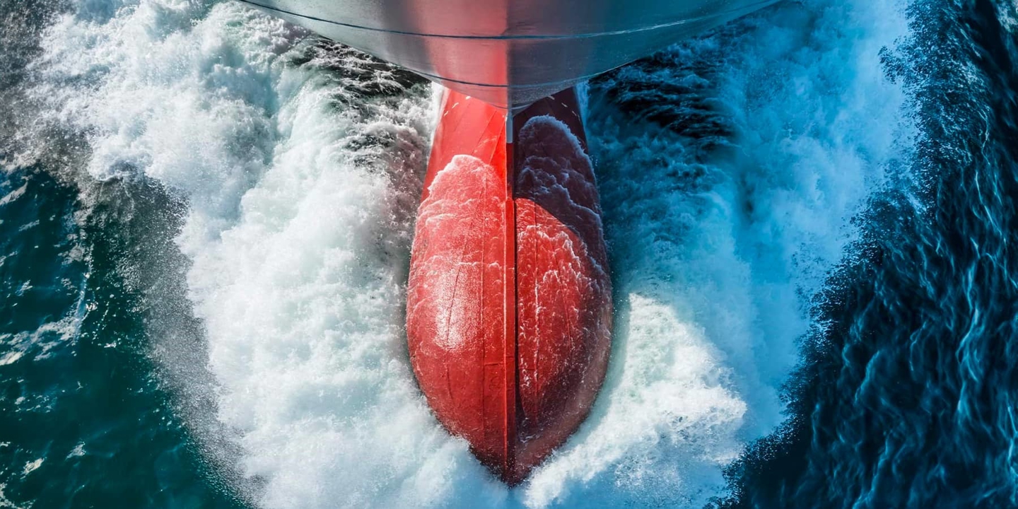 Ship's bulbous bow through the water photographed from above
