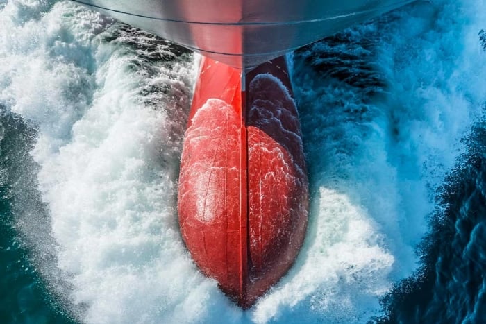 Ship's bulbous bow through the water photographed from above
