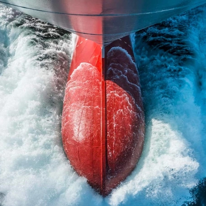 Ship's bulbous bow through the water photographed from above
