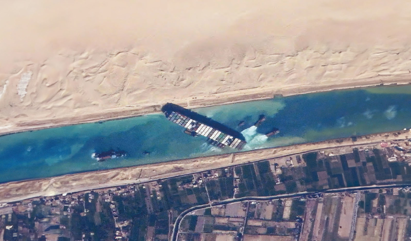 A container ship blocks the Suez Canal. 