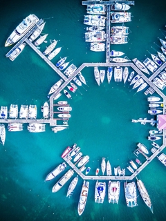 Blue sea, shipping dock from above.
