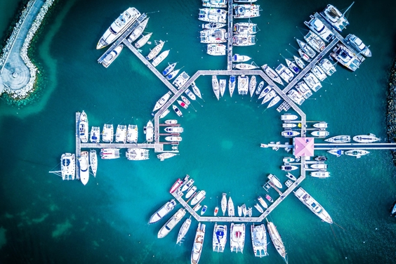 Blue sea, shipping dock from above.