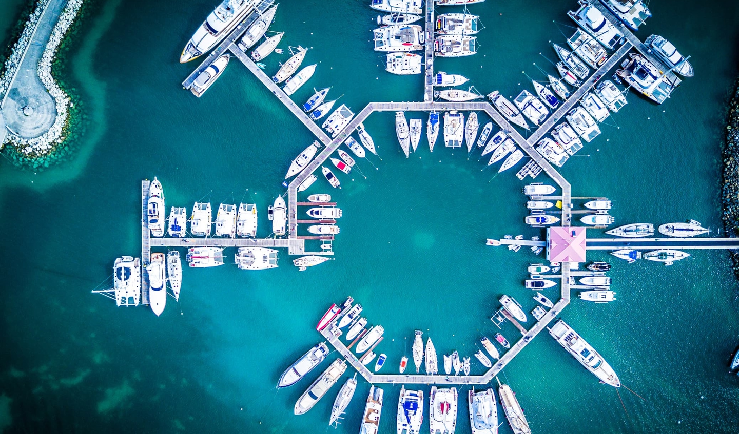 Blue sea, shipping dock from above.