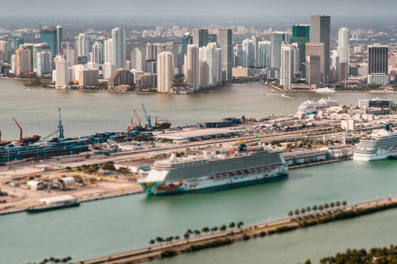 A large harbour with docks and cruise ships