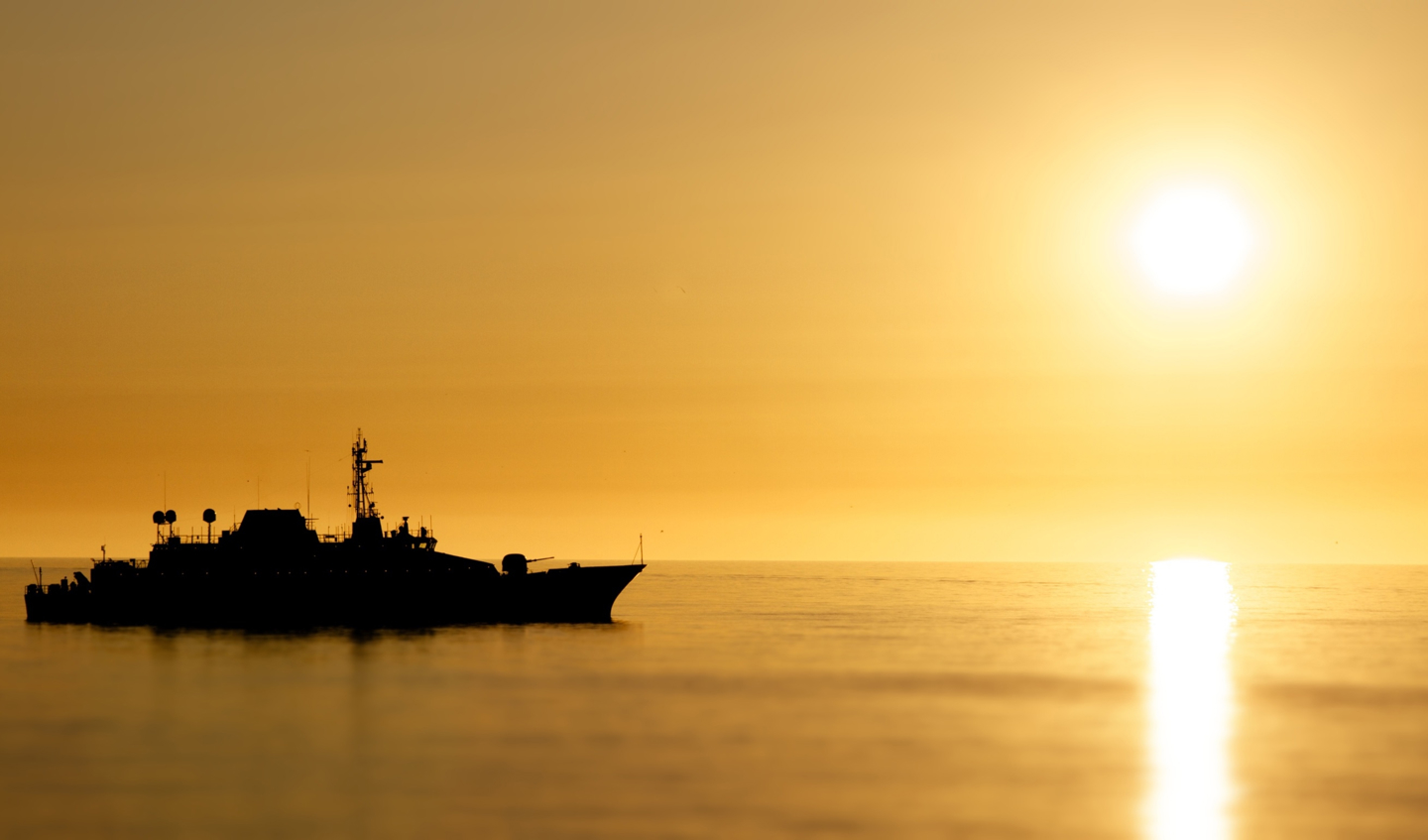 Ship on the sea at sunset.