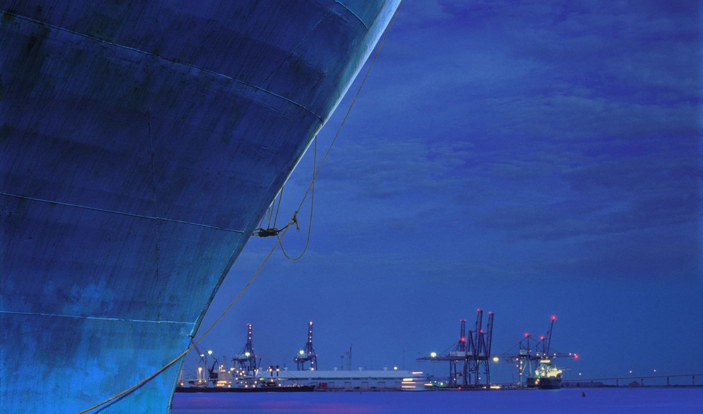Ship up close back by a purple night sky