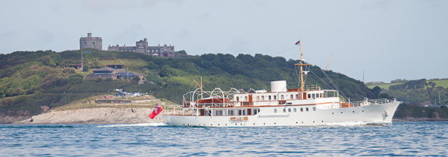 Malahne yacht on the water, mountainous backgrounds.