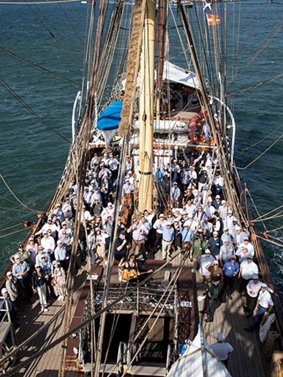 Group photo of Australian colleagues on the deck of a tall ship