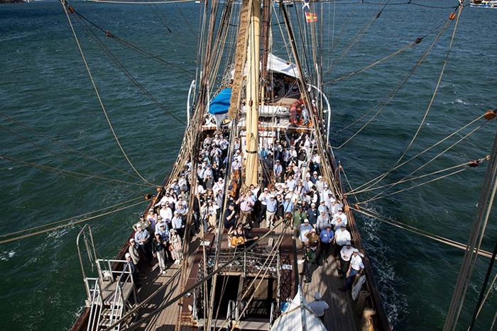 Group photo of Australian colleagues on the deck of a tall ship