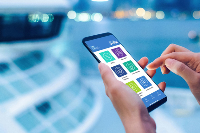 A person holding a mobile phone using the PSC pocket checklist app in focus against a blurred out background