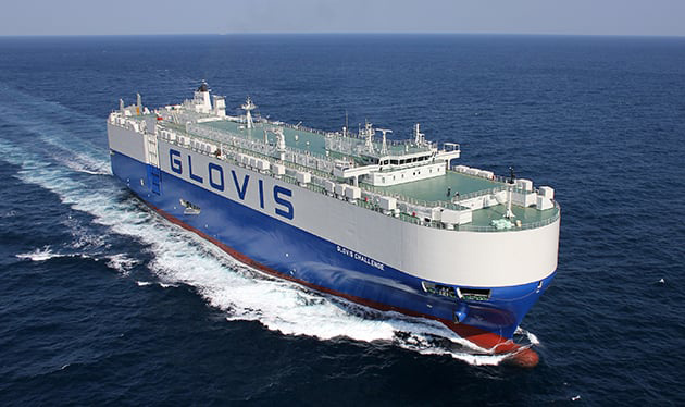 Vision of the Glovis vessel in the ocean with the large Glovis logo in full view.
