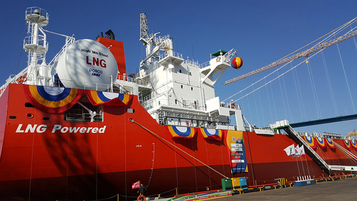 Closeup image of LNG Powered bulk carrier ship with the LNG fuel tank in view, docked.