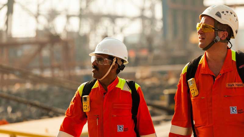 Lloyd's Register experts surveying site wearing safety helmets and googles