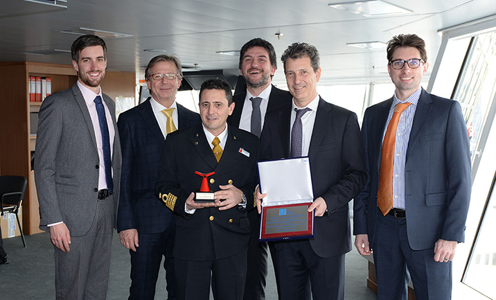 LR staff on the bridge with Carnival Horizon Captain Luigi De Angelis.