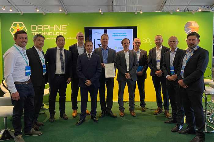 Group photo of members from LR and Daphne Technology with one employee holding the framed Approval in Principle document.