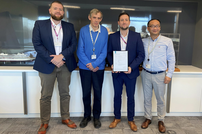Group photo of Lloyd's Register and Datum Electronics representatives with award for Type Approval.