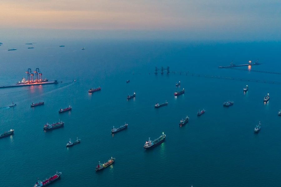 Ships moored at sea at sunset - aerial view