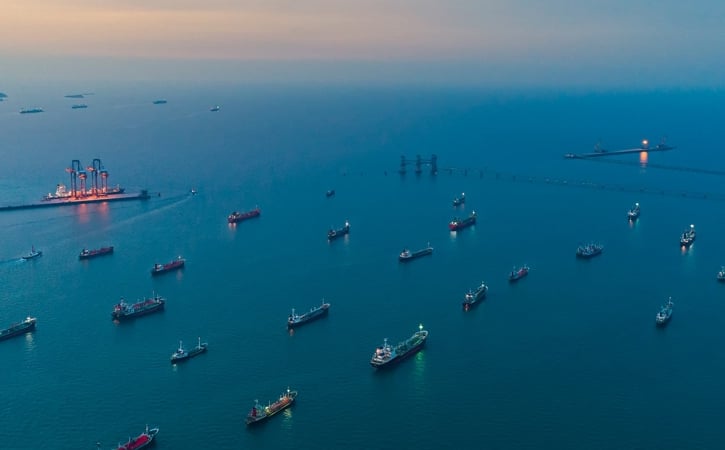 Ships moored at sea at sunset - aerial view