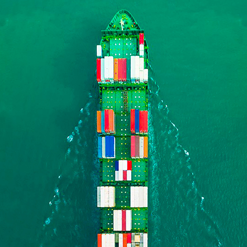Overhead view of cargo ship in ocean
