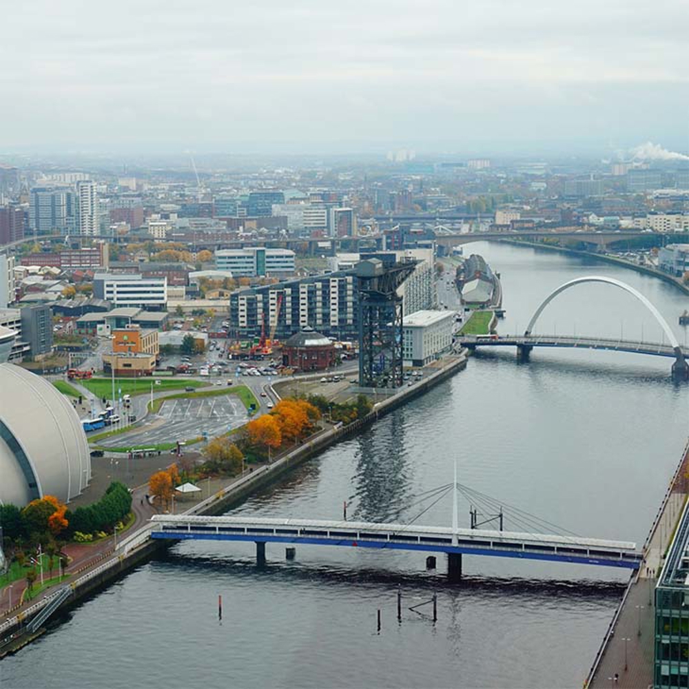 River runs through cityscape.