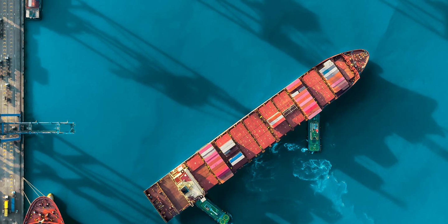 Cargo ship turning in port